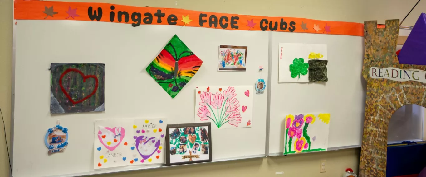 Wingate FACE Cubs Board with Student Projects Pinned to the Board.