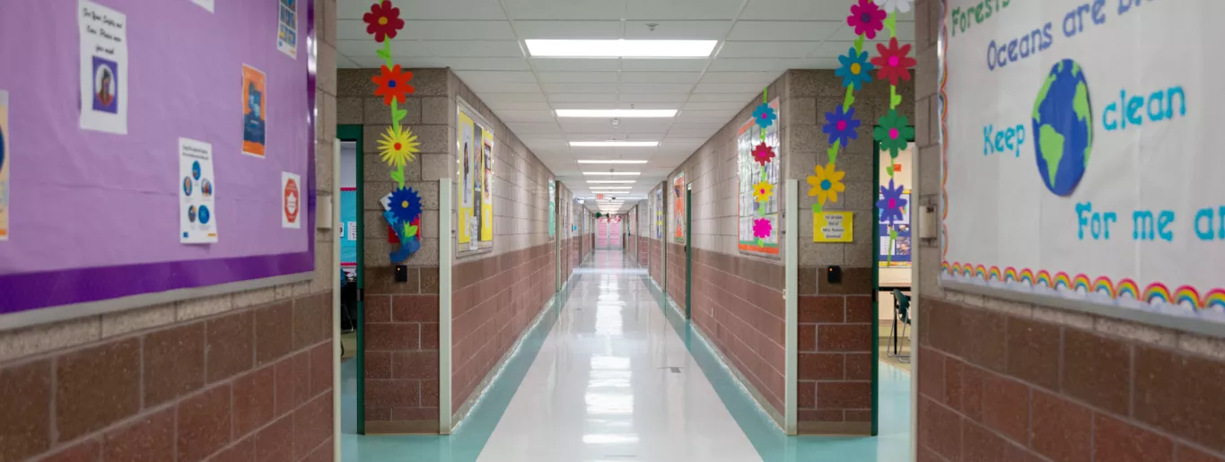 Wingate Elementary School Long, Bright Hallway with Classroom Entrances on Both Sides and Shiney Floors.