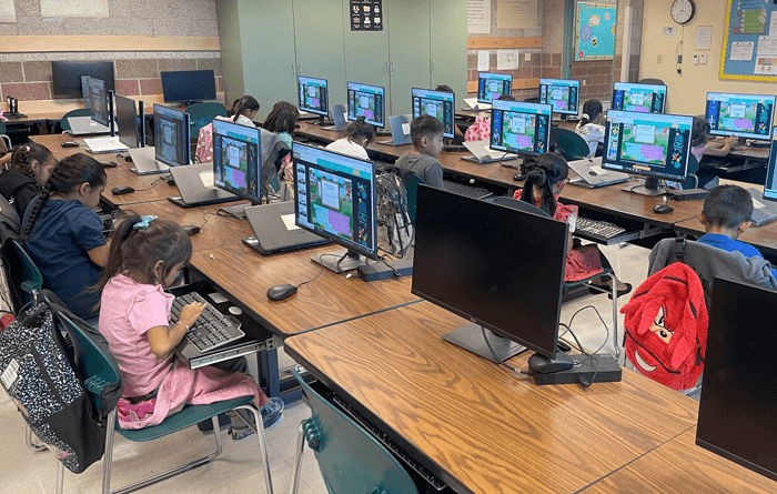 Class full of students using new MS-BIE laptop devices
