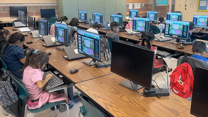 Class full of students using new MS-BIE laptop devices