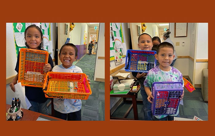 Students holding school projects. 